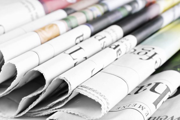 A stock image of newspapers representing what has been in the news today